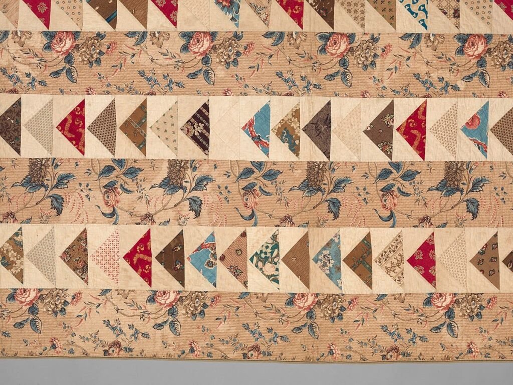 Flying geese quilt block with many colorful triangles