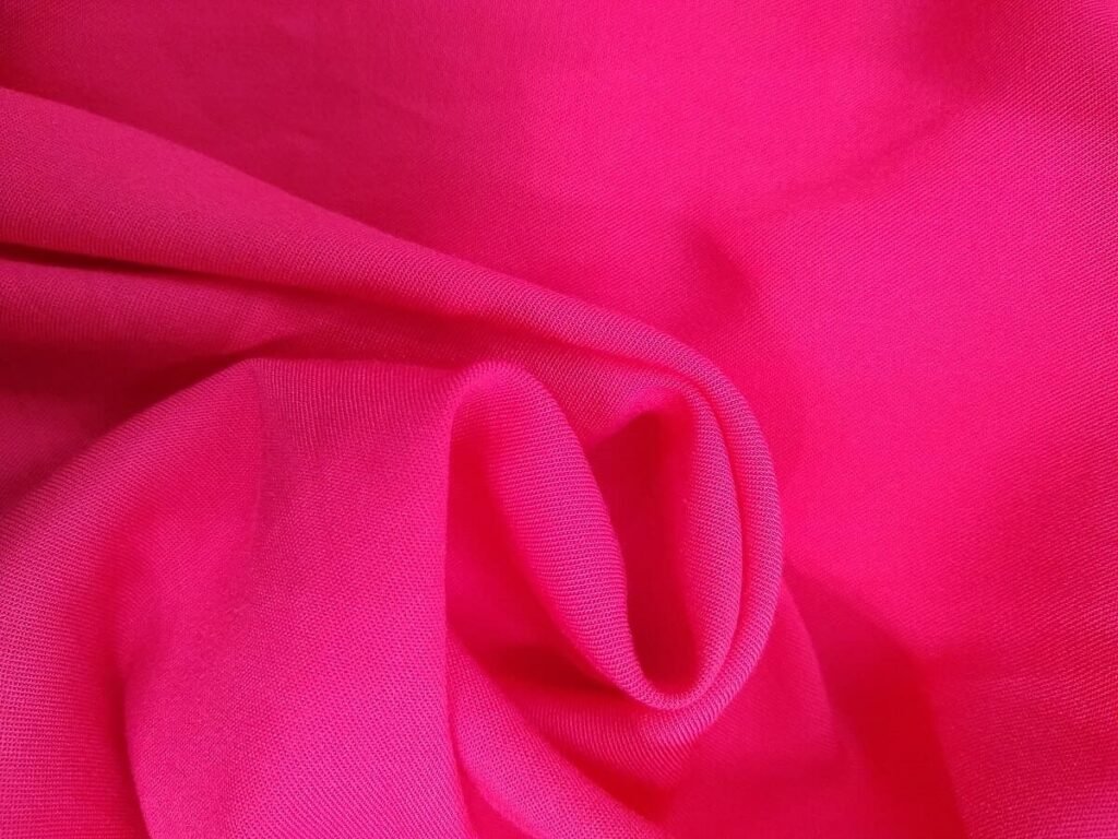 Reddish pink rayon fabric