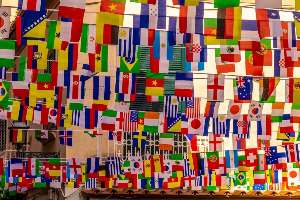 Many colorful flags of all nations hung together